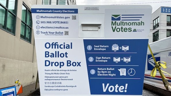 US election: 475 damaged ballots recovered from charred ballot box in Washington, says auditor