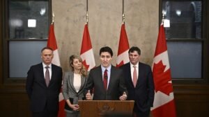 As Trump threatens Canada with tariffs & annexation, Trudeau’s Liberal Party surges